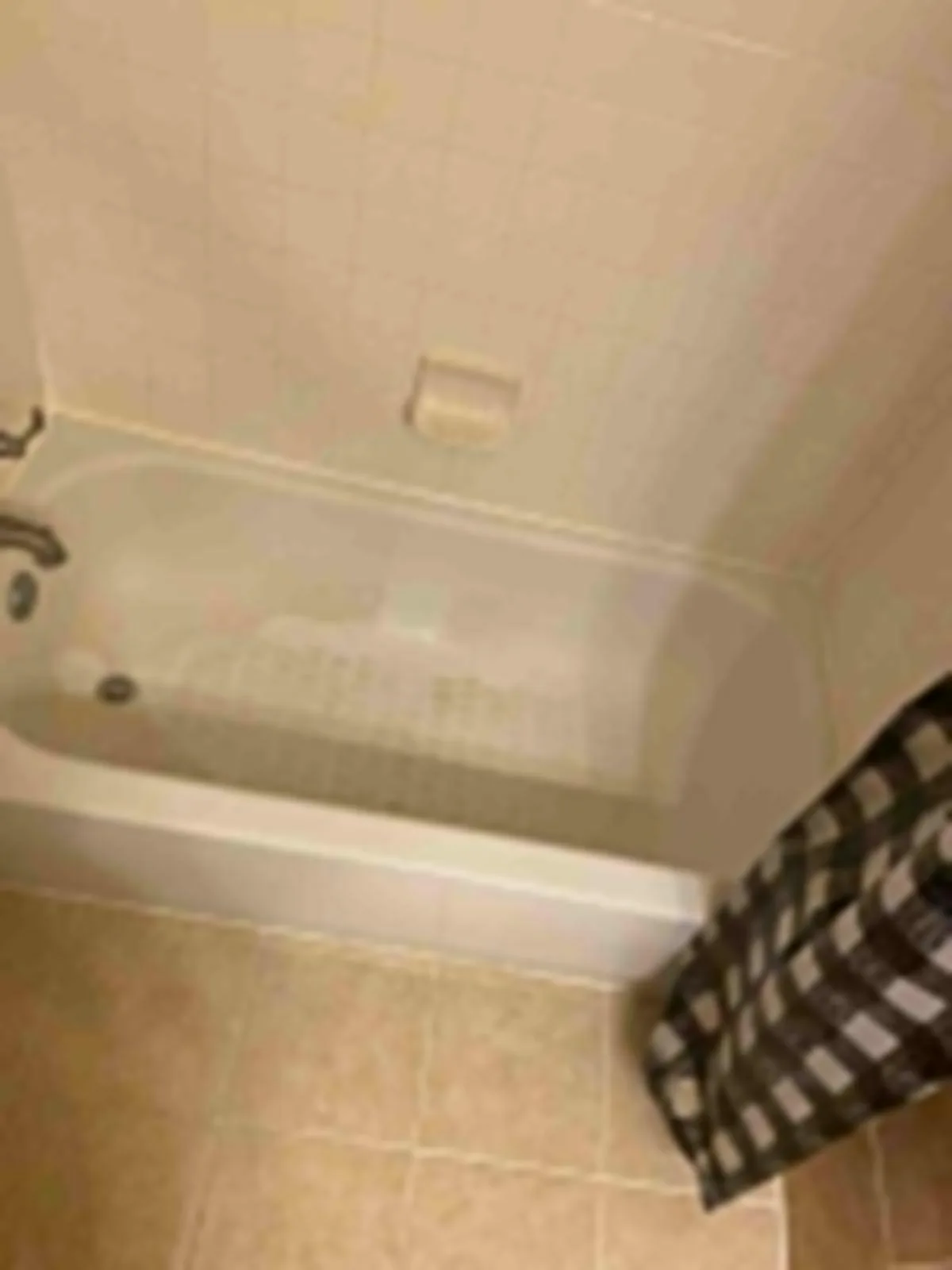 Soaking tub wiped down with faucet polished