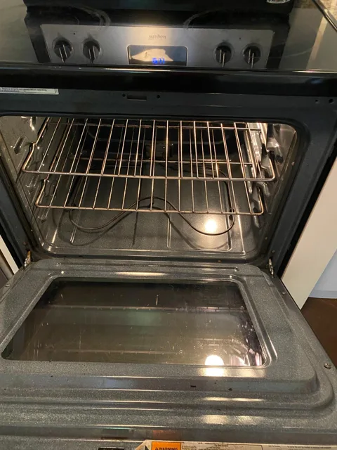 Stainless oven interior cleaned until the racks shine