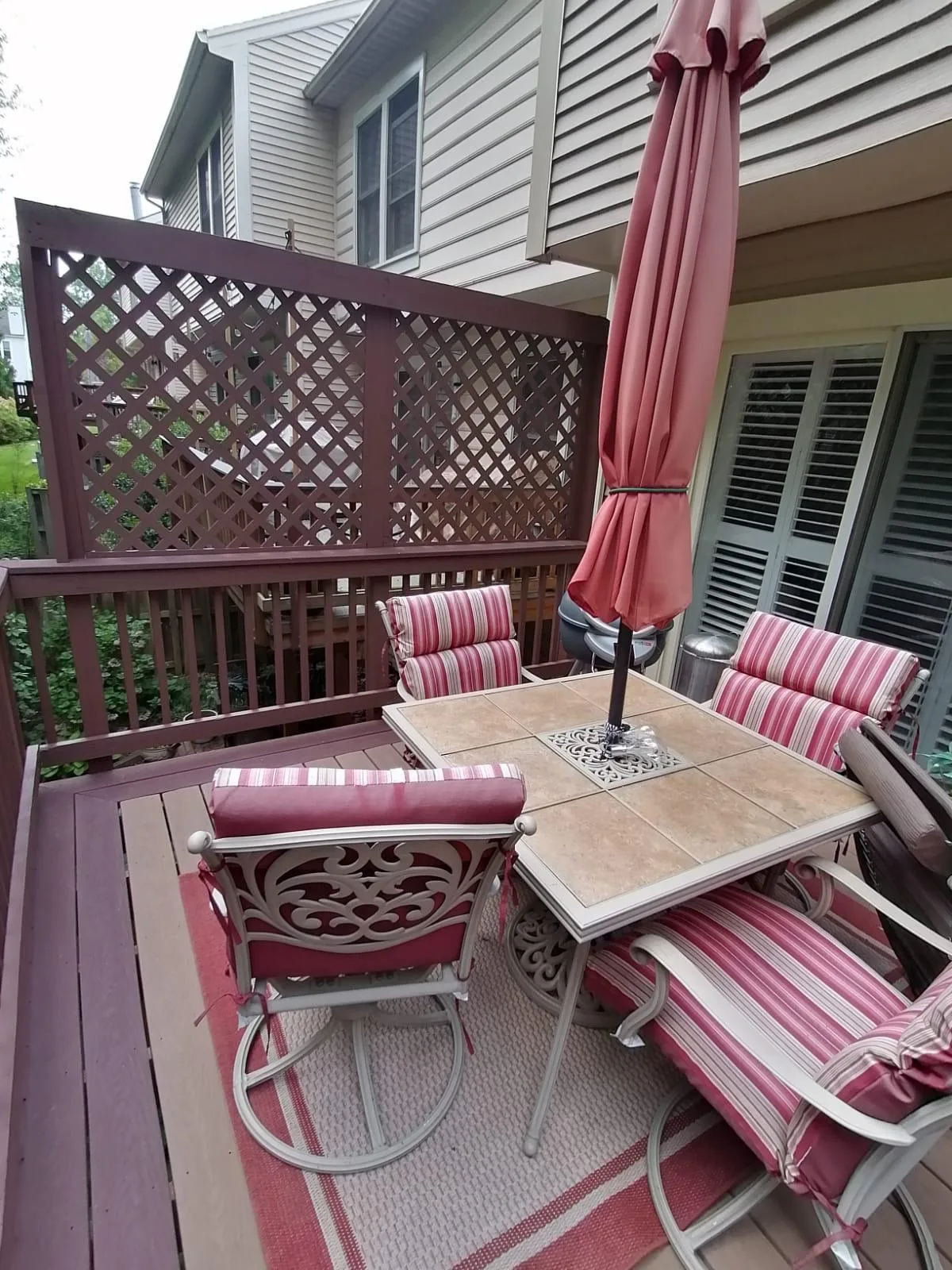 Outdoor patio furniture and deck cleaned and arranged